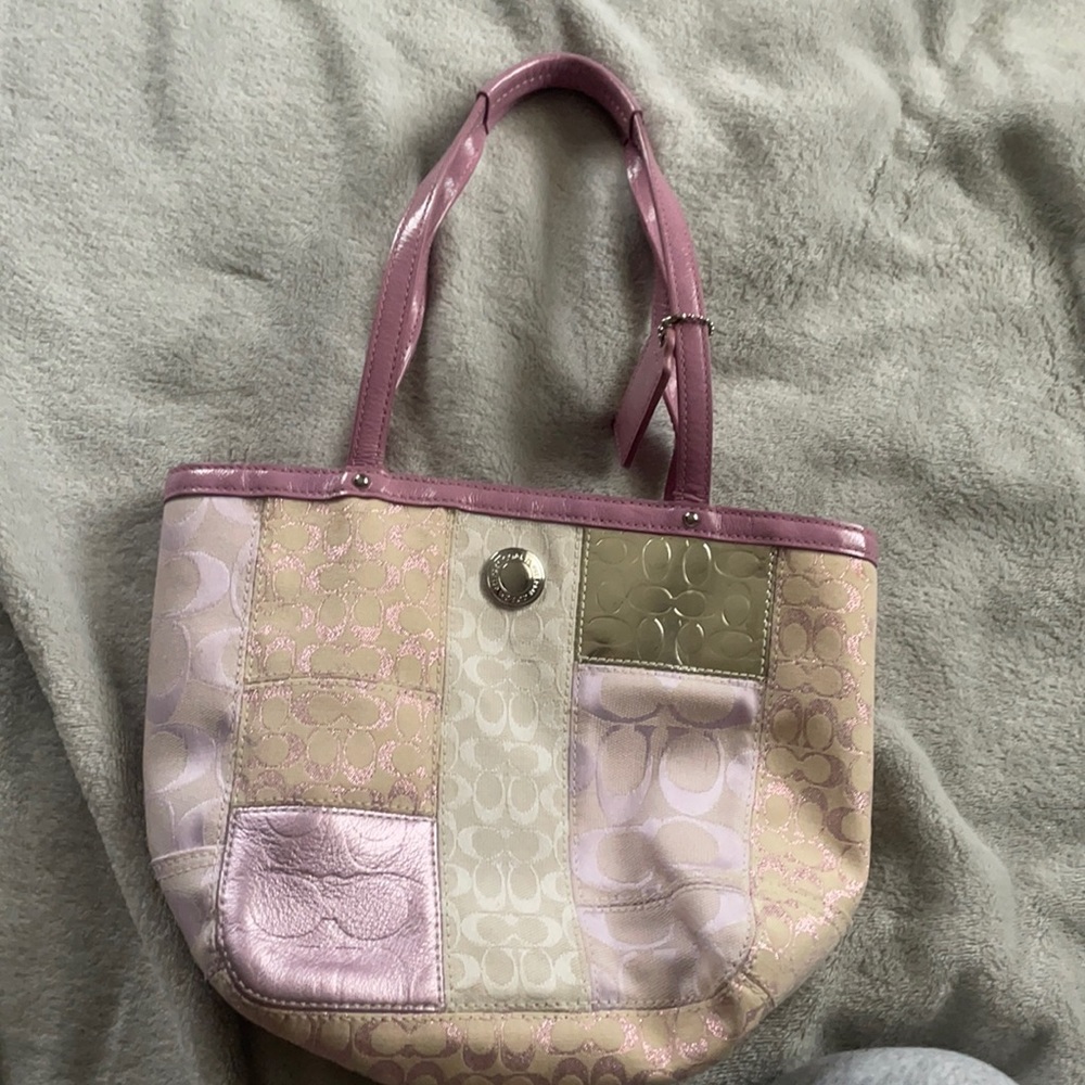 Small purple used Coach bag